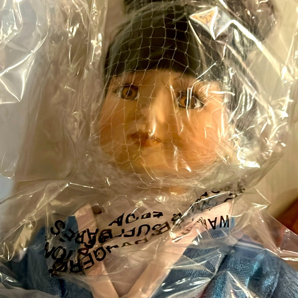 Porcelain Oriental doll